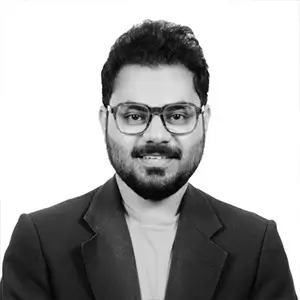 Black-and-white professional portrait of Abdul Samad wearing glasses and a dark blazer against a light background.