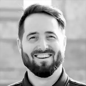 portrait.webp Black-and-white headshot of Dr. Brian Harman smiling toward the camera.